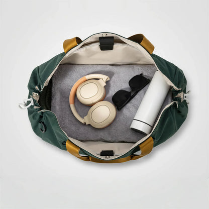 CourtDuet Bag in Court Forest interior packed with towel, headphones and water bottle