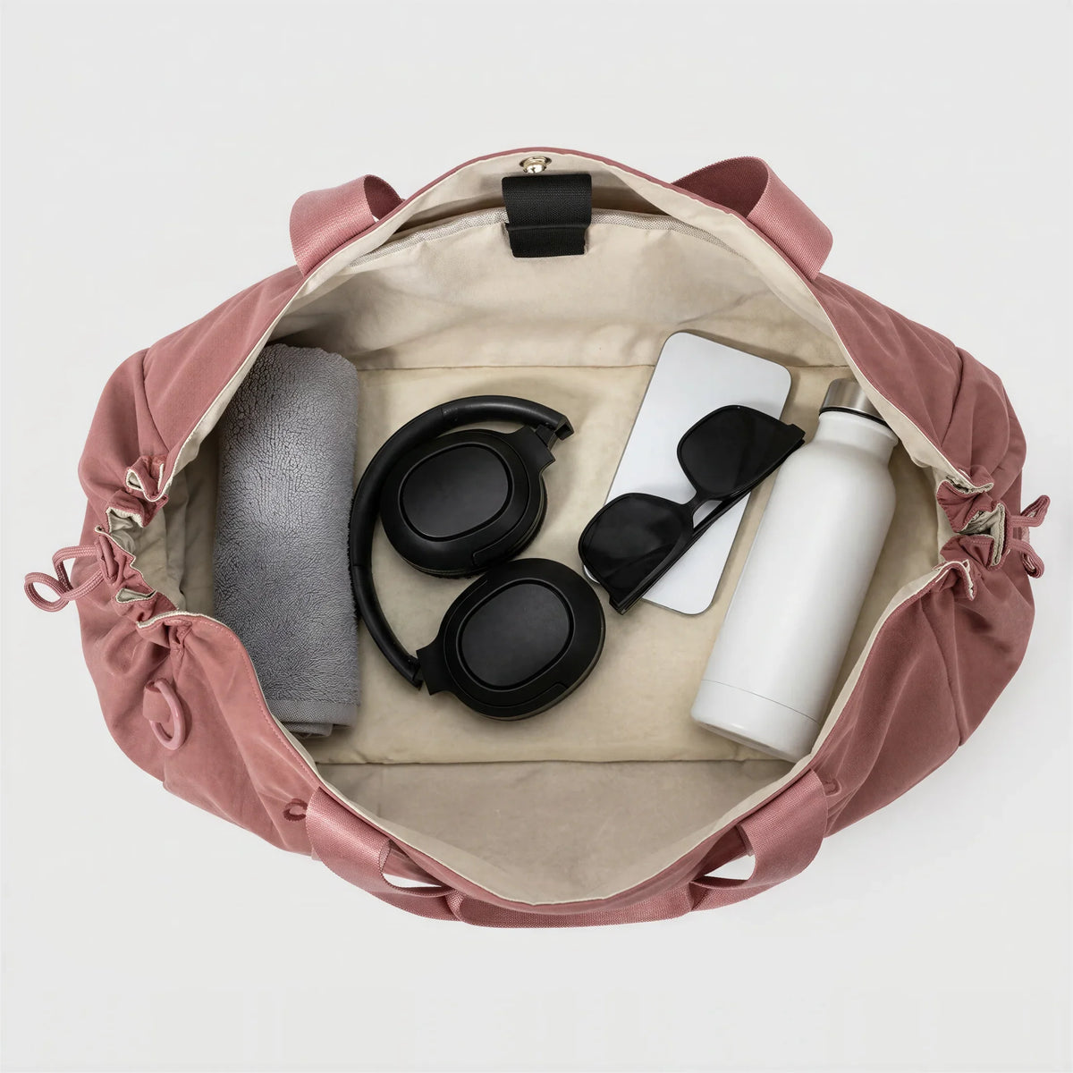 CourtDuet Bag in Orchid Pink interior packed with towel, headphones and water bottle