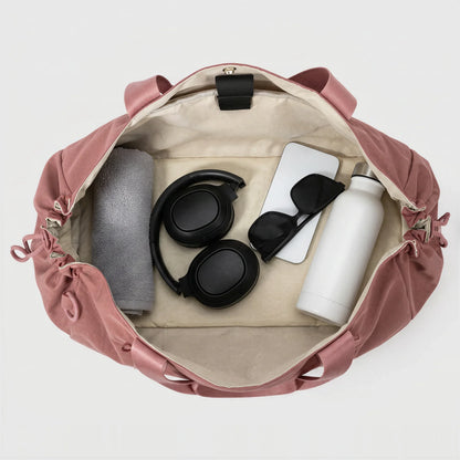 CourtDuet Bag in Orchid Pink interior packed with towel, headphones and water bottle